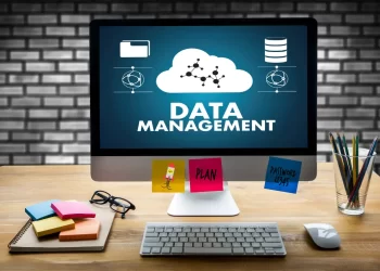 Computer Monitor Displaying Data Management Concepts with Related Icons