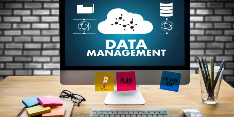 Computer Monitor Displaying Data Management Concepts with Related Icons