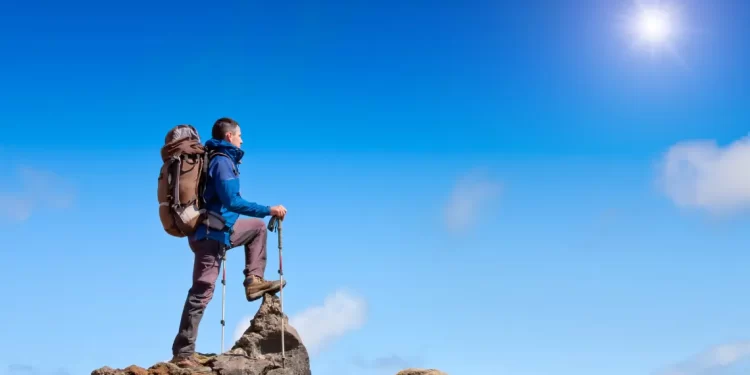 Hiker at the summit, symbolizing achieving milestones in the Programming Roadmap.