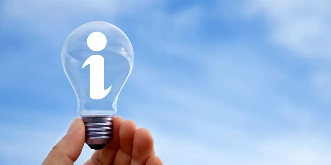 Hand holding a lightbulb with an information icon