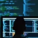 Person working on software testing with multiple screens