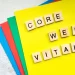 Core Web Vitals displayed with wooden letter tiles on colorful paper background