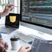 Developers working with JavaScript code on multiple screens