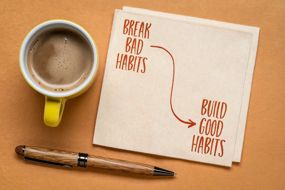 Break bad habits and build good habits visual with coffee and pen