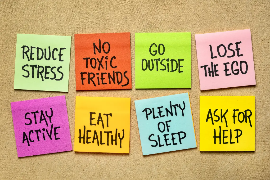 Post-it notes with self-care and habit advice like reduce stress, eat healthy, stay active